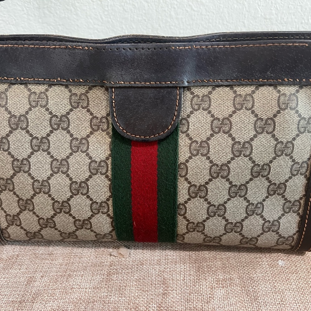 Authentic Gucci Brown Monogram Canvas Clutch with Green and Red Web Stripe